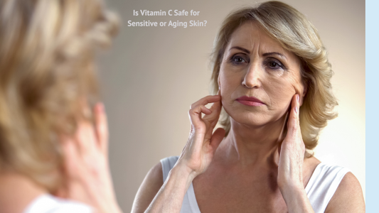 “Woman over 50 examining her skin in the mirror; dermatologist guidance on Vitamin C safety for sensitive or aging skin.”